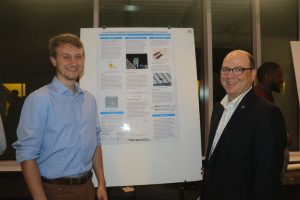 Glennn Lightsey and a student with a poster