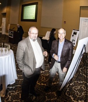 Bill Lewis, left, with another, unnamed attendee of the VLRCOE reception