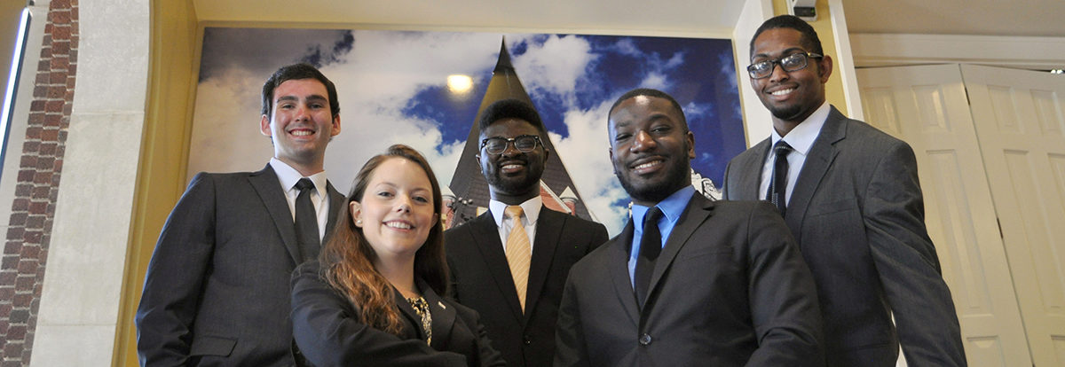 Five students (one female, four males) at the 2016 AE Career Fair