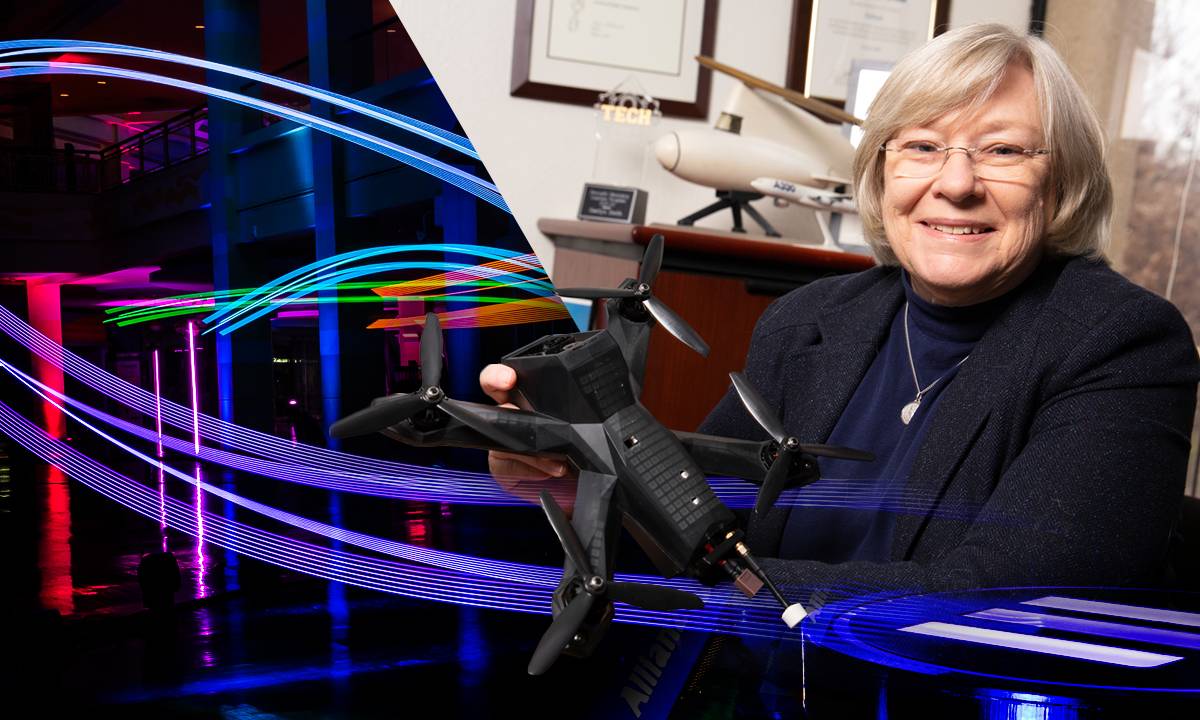 aerospace engineering professor, Marilyn J. Smith, poses with a drone vehicle