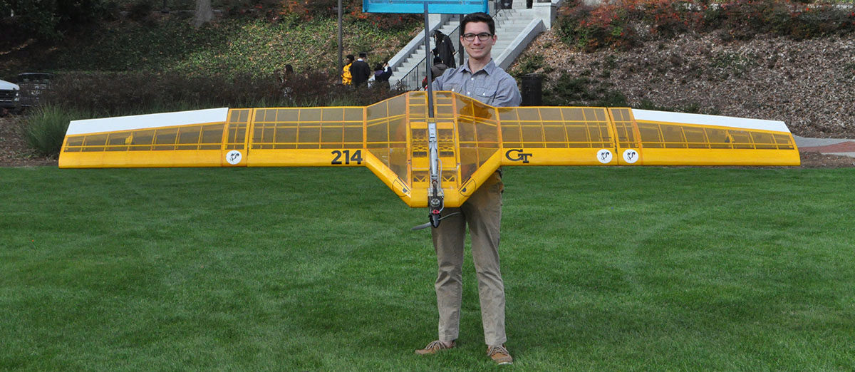 Frank Kozel standing with BUzz Bomber the award-winning prototype he's worked on with the SAE club