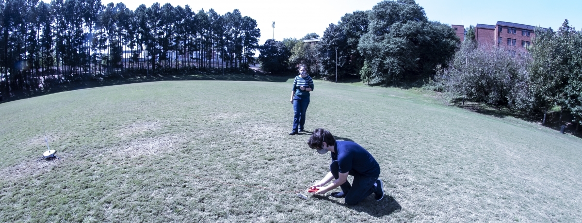 Kelly Griendling instructing a student just seconds before he launches his rocket