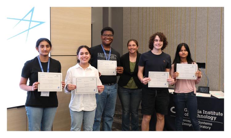 Group of students posing with their newly earned certificates