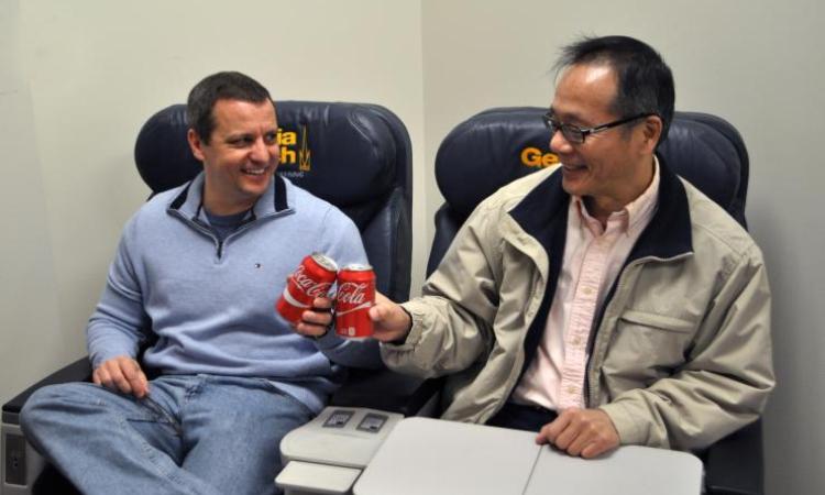 <p><strong>A toast to the future</strong>. Gary Weissel and GT-AE school chair Vigor Yang christened the first-class seating that's now available in MK 301.</p>