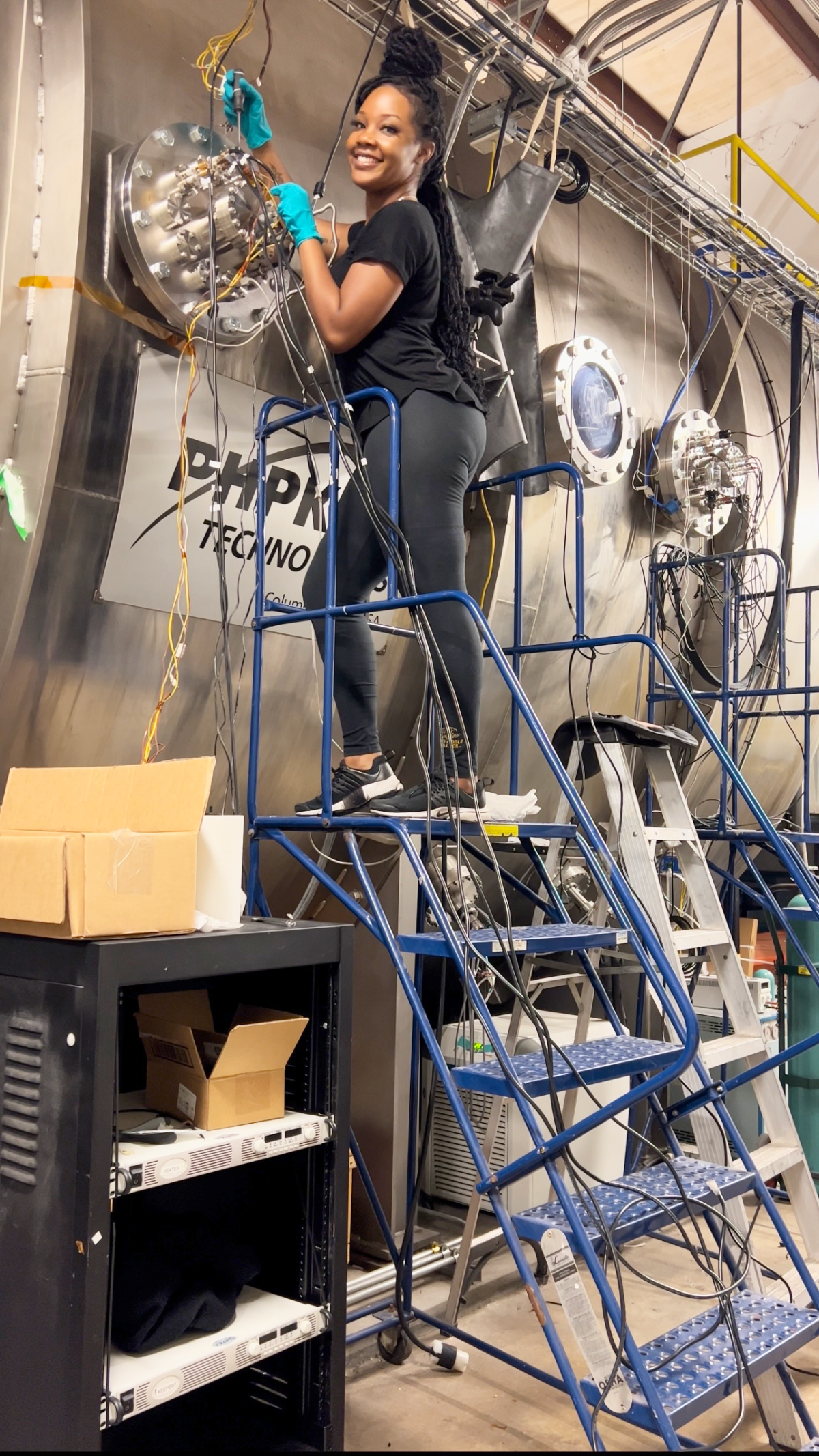 Photo of Naia Butler-Craig in the High-Power Electric Propulsion Lab (HPEPL)