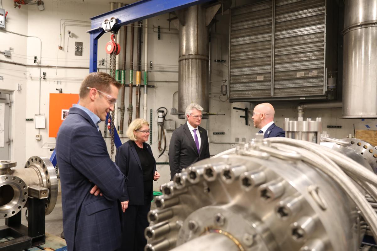 NASA Deputy Adminstrator and House of Representatives members visit Georgia Tech , shown walking with Mitchell Walker