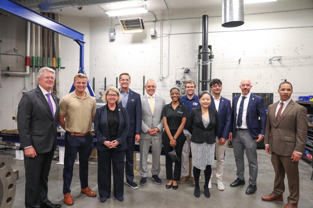 NASA Deputy Administrator and House of Representatives members visit Georgia Tech , shown walking with Mitchell Walker