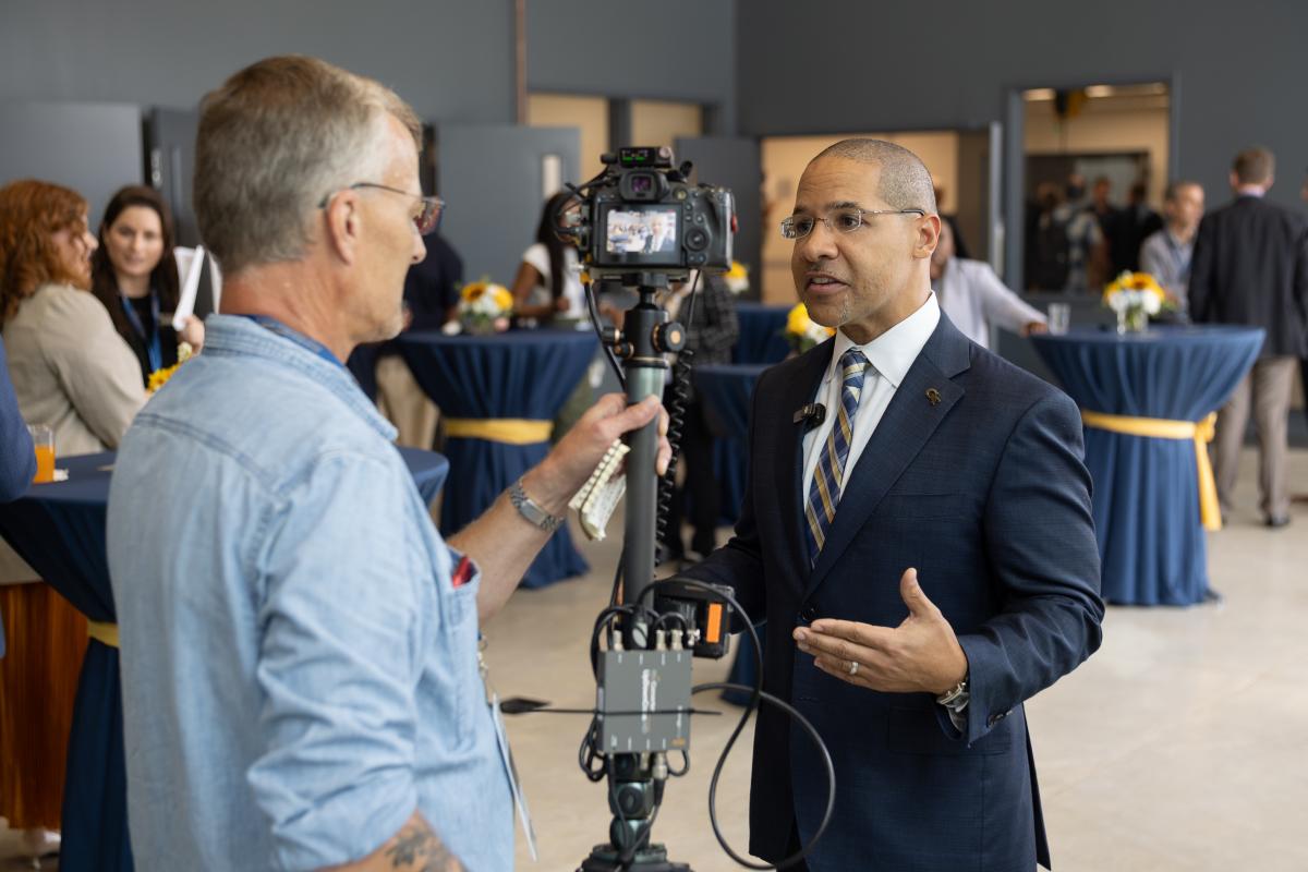 Mitchell Walker being interviewed by media during the AE School Aircraft Prototype Laboratory ribbon cutting ceremony